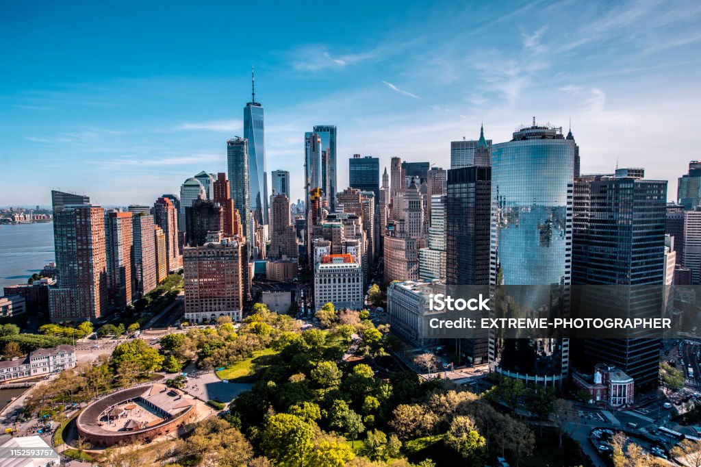 Helicopter view of a Battery Park and a Castle Clinton National Monument in Downtown Manhattan taken at golden hour.